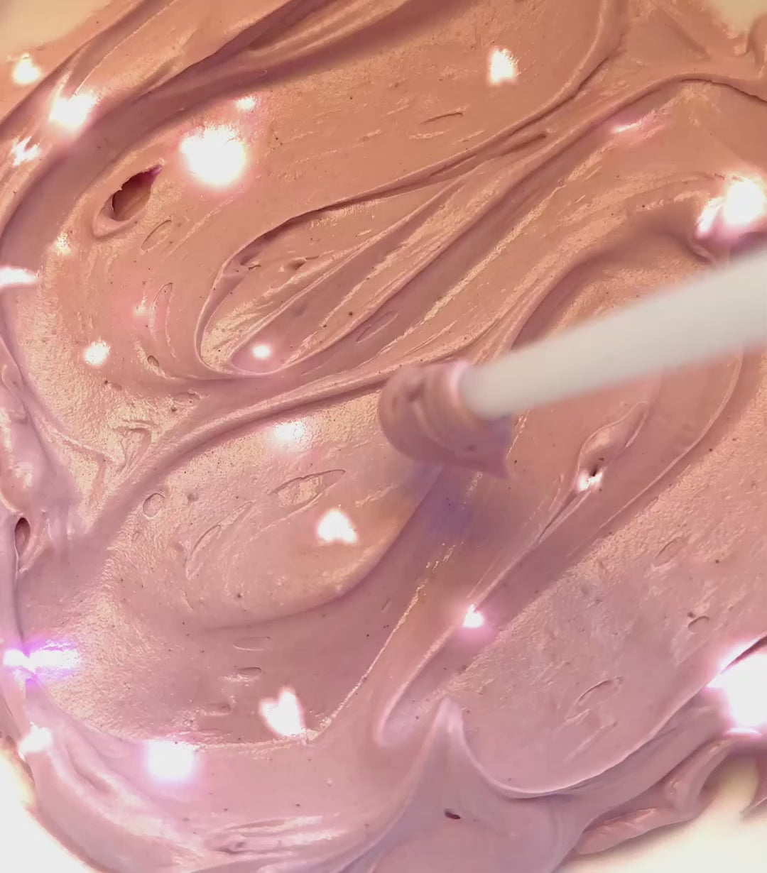 Load video: A heart shaped with a glass stir stick in the Twilight Berry comfort cream